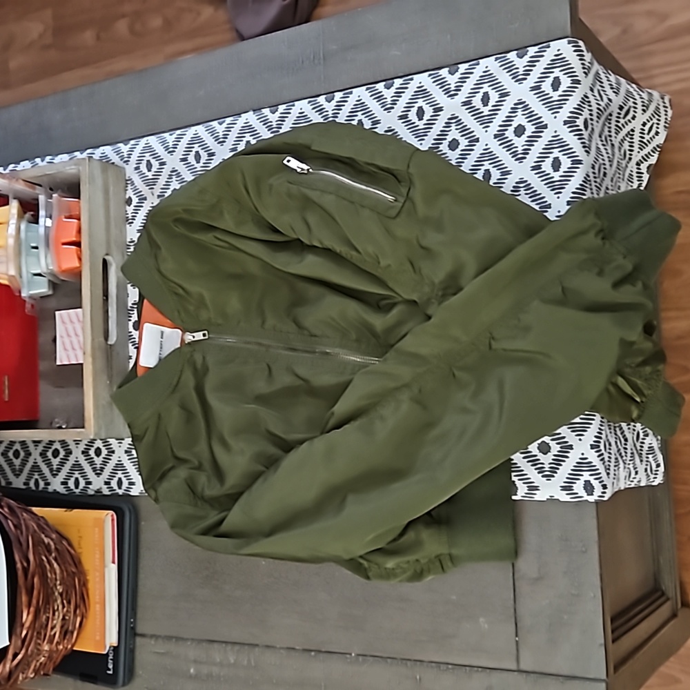 A green cropped sweater